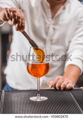 Barman at work, preparing cocktails