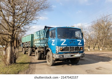 Barmashovo, Ukraine - March 18, 2022: War Of Russia Against Ukraine. Concept Of Invasion. Stolen Ukrainian KAMAZ Truck In The Village With Z Fascist  Russian Symbol Left After Invasion Battle With ZSU