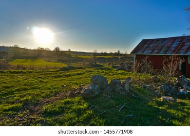 A barn in the light of a sunset