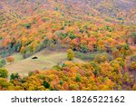 A barn sits in a pasture in this aerial view from the top of Seneca Rocks in West Virginia during peak foliage