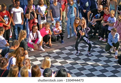 Barnaul, RUSSIA - 24 August 2019: Girls 15 - 20 Years Old Dance On The Street Dance Floor During Dance Competitions. The Confrontation Between The Dancers. View From Above. Dance Battle Festival.