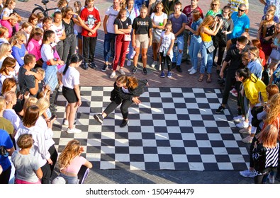 Barnaul, RUSSIA - 24 August 2019: Girls 15 - 20 Years Old Dance On The Street Dance Floor During Dance Competitions. The Confrontation Between The Dancers. View From Above. Dance Battle Festival.