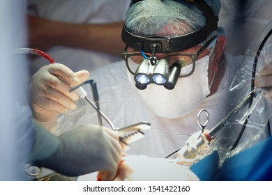 Barnaul, Russia-September 19, 2019.  Masked heart surgeon performs open heart surgery
