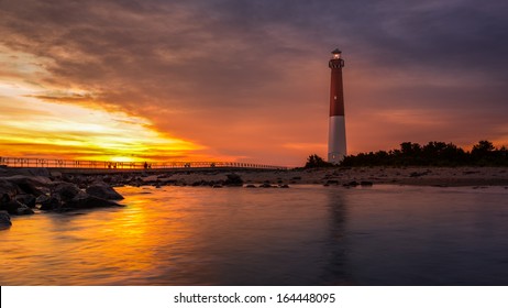 Barnegat Lighthouse at sunset.  Barnegat Lighthouse is a historic landmark located on the northern tip of Long Beach Island.