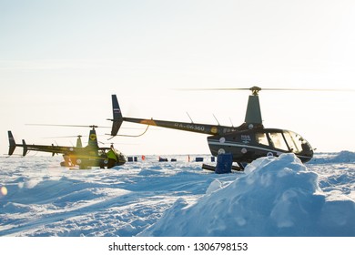 Barneo Drifting Camp, North Pole - April 11, 2015: Helicopters Standing On Ice Of North Pole. Sunny Frosty Weather. Snow On Arctic Ice. 