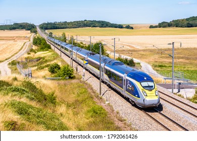 Baron, France - July 29, 2020: A Eurostar E320 High Speed Train Is Driving From Paris To London On The LGV Nord, The North European High Speed Railway Line, In The French Countryside.