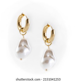 Baroque Pearl Drop Earrings dangling on white background - Shutterstock ID 2151041253