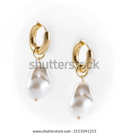 Baroque Pearl Drop Earrings dangling on white background Foto d'archivio © 