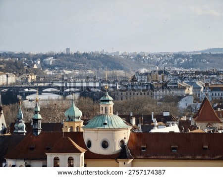 Baroque rooftops and copper domes framing historic skyline, ornate facades, red tile roofs, verdigris cupolas,