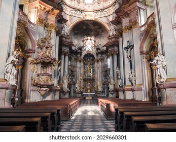 Baroque Saint Nicholas Church with Nave and Altar in Prague, Czech Republic, also called Kostel Svateho Mikulase. - Powered by Shutterstock