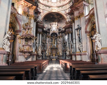 Baroque Saint Nicholas Church with Nave and Altar in Prague, Czech Republic, also called Kostel Svateho Mikulase.