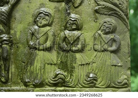 Baroque stone epitaph with a relief of praying women