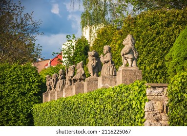 Baroque Stony Figures Of The Dwarf Cabinet Near Castle Of Nove Mesto Nad Metuji, Czech Republic. Dwarf Cabinet Is Mini Sculptures Created Baroque Sculptor In 18th Century