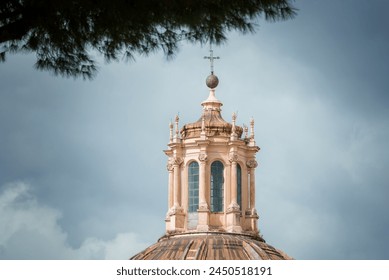 Baroque style dome with ornate lantern in European city. Ribbed design enhances aesthetic appeal under partly cloudy sky. Historical and religious architecture visible. - Powered by Shutterstock