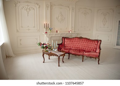 Baroque Style Interior With Red Luxury Sofa And Table In The Middle