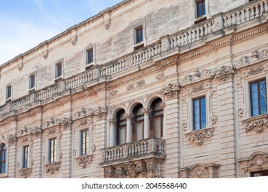 baroque work exterior of the facades of the palazzo del seminario, emphasis on the rich framing of columns and balusters of the balcony of the museum