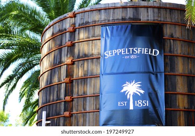 BAROSSA VALLEY, SOUTH AUSTRALIA - MAY 29, 2014: Large Blue Signage On Old Wood Vats At Entrance Of Seppeltsfield Winery.