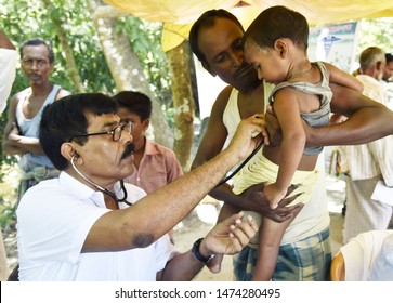 Barpeta, Assam, India. August 7, 2019.  Doctor  Treats Flood Victims At A Free Medical Health Camp At A Flood Affected Village In Assam.