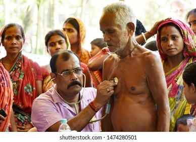 Barpeta, Assam, India. August 7, 2019.  Doctor  Treats Flood Victims At A Free Medical Health Camp At A Flood Affected Village In Assam.