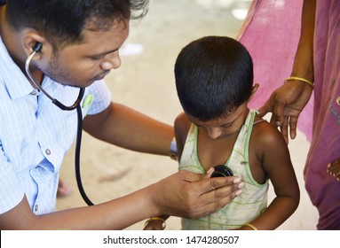 Barpeta, Assam, India. August 7, 2019.  Doctor  Treats Flood Victims At A Free Medical Health Camp At A Flood Affected Village In Assam.