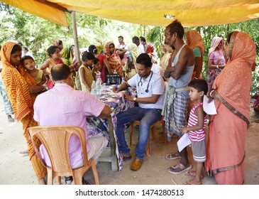 Barpeta, Assam, India. August 7, 2019.  Doctor  Treats Flood Victims At A Free Medical Health Camp At A Flood Affected Village In Assam.