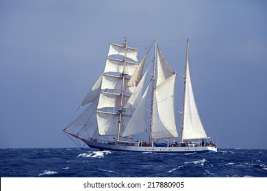 Barquentine With White Sails In The Calm Sea