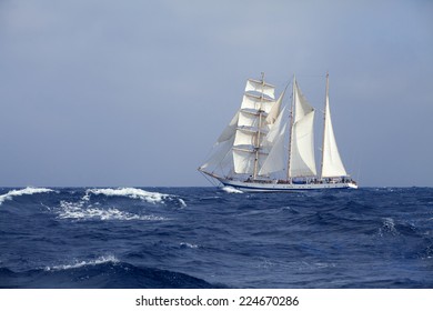 Barquentine With White Sails In The Calm Sea