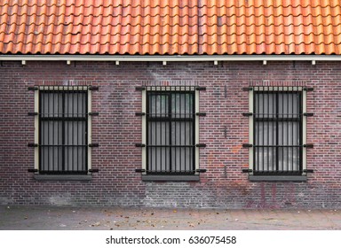 Barred Windows In A 19th Century Prison Complex