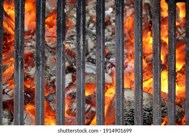 Barrel Or Brazier Grill Pit With Flaming Charcoal. Top View Of BBQ Hot Grill With Cast Iron Grid, Isolated Background, Overhead View. Barbecue Grill Background Texture