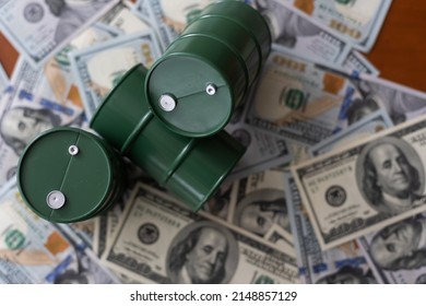 Barrel Of Crude Oil With Dollar Bills. Close Up. Business Concept.