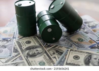 Barrel Of Crude Oil With Dollar Bills. Close Up. Business Concept.