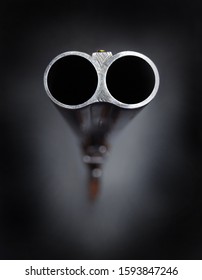 Barrel of a gun on black background.