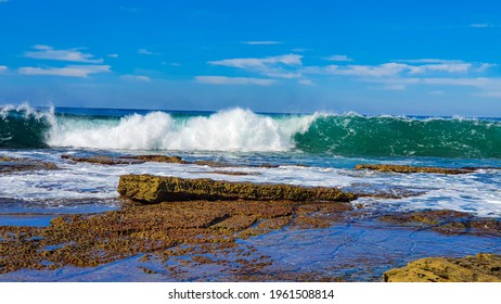 The Barrel Wave On A Rocky Beach