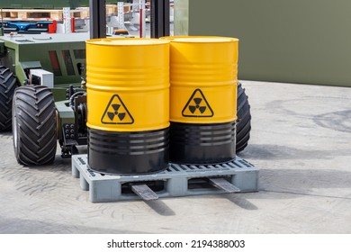 Barrels with poisonous substance. Poisonous chemicals in yellow barrels. Hazardous substances on forklift. Concept transporting poisonous cargo. Radiation hazard sign. Waste of chemical production - Shutterstock ID 2194388003