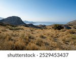 Barren landscape, beach with mountains and bays in the background, clear blue sky, early morning, landscape, wide-angle lens