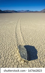 Barren Vista Of The Racetrack At Death Valley National Park Showing One Of The Mysterious Wandering Rocks