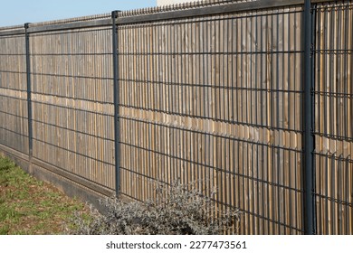 barrier brown wooden and steel high fence private house suburb wood protect home - Shutterstock ID 2277473561