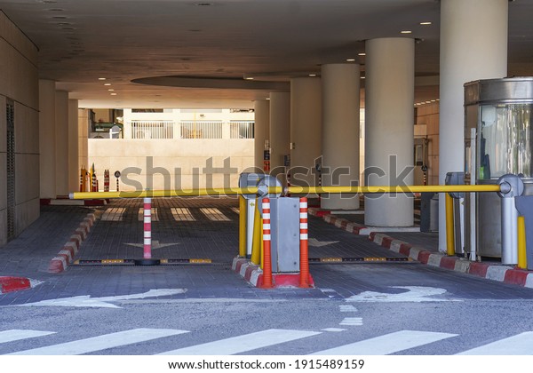 Barrier at\
Entrance and exit of a car Parking garage. barrier in a car park.\
Exit from underground parking. Underground parking, garage.\
Interior of parking                       \
