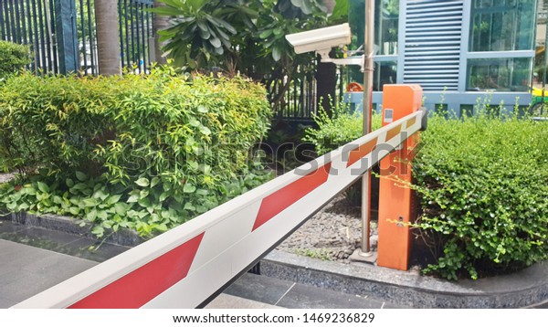 Barrier gate, automatic entry system in\
front of condominium, apartment for visitor car.\

