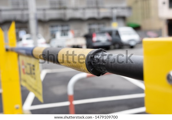 barrier gate automatic system for security,\
closeup image in shallow depth of\
focus