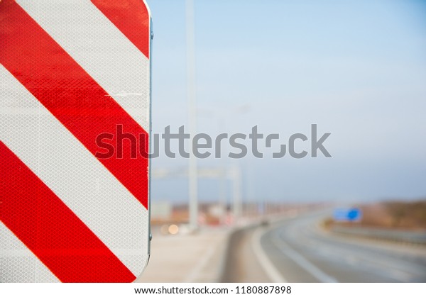 Barrier,\
guard rail, designed to prevent the exit of the vehicle from the\
curb or bridge, moving across the dividing\
strip