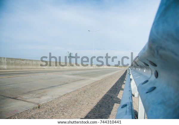 Barrier, guard rail, designed to prevent the exit\
of the vehicle from the curb or bridge, moving across the dividing\
strip.