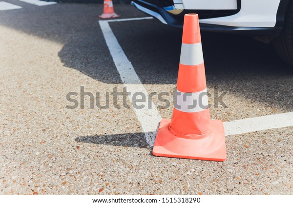 Barrier. Passage\
is closed. Driveway closed. Entry is prohibited. Protected and\
restricted area, limits. Red and white striped concrete road\
barriers lying on the asphalt\
pavement.
