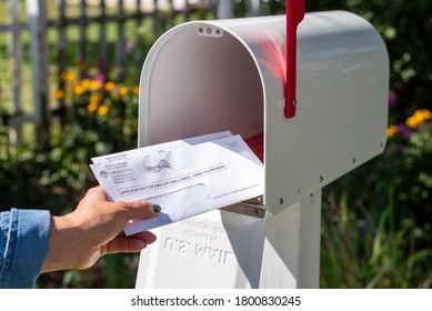 Barrington, IL/USA - 08-22-2020:  Receiving applications to vote by mail for 2020 US presidential election via US Postal Service during COVID-19 pandemic