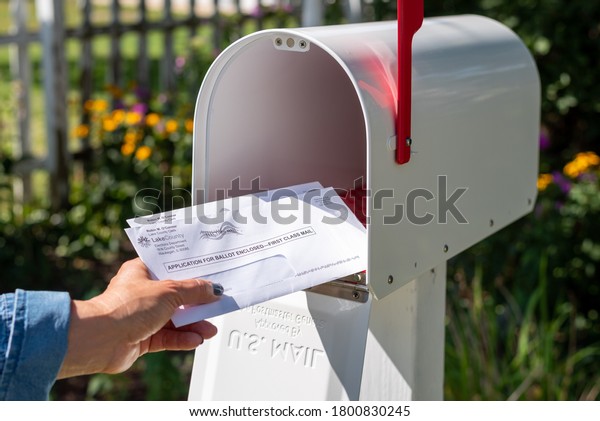 Barrington, IL/USA - 08-22-2020:  Receiving\
applications to vote by mail for 2020 US presidential election via\
US Postal Service during COVID-19\
pandemic