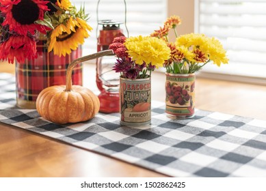 Barrington, IL/USA - 09-09-19: Using Soup Cans With Vintage Labels To Hold Fresh Flowers For Fall Centerpiece, DIY Projects And Ideas