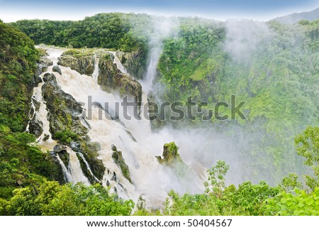 The Barron Falls - massive waterfall in Australia surrounded by tropical rainforest