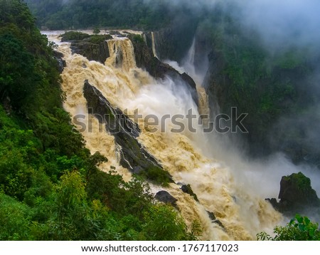 The Barron Falls s a steep tiered cascade waterfall on the Barron River located where the river descends from the Atherton Tablelands to the Cairns coastal plain, in Queensland, Australia.