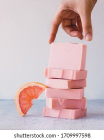 Bars of handmade natural soap infused with grapefruit essential oil / organic beauty concept / Nourishing DIY beauty recipes