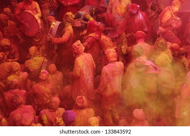 BARSANA - MAR 21: Devotees celebrate a traditional and a ritualistic Holi at Radharani temple on March 21, 2013 in Barsana, India. Holi is the most celebrated festival in India.